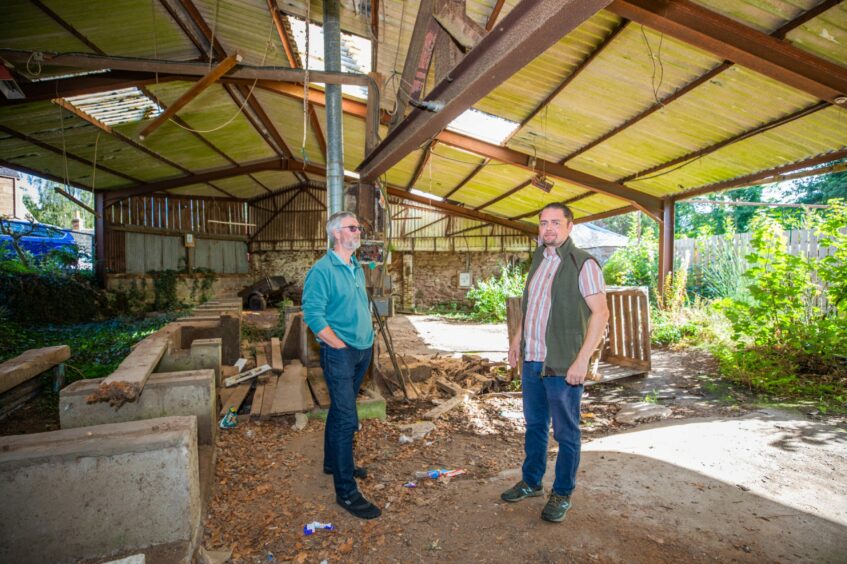 George Hall, chair of Alyth Development Trust, and Martin Devaney, planning consultant, at the old Millhaugh sawmill in Alyth