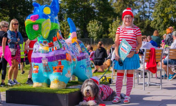 Fest fancy dress winners Diane Colville and bearded collie Archie , 8, from Tayport, with the Tayport Scottie sculpture. Image: Steve MacDougall/DC Thomson