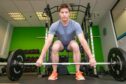 Fife physio expert Benji Gilbert enjoys working out in the gym at his work. He is pictured doing barbell deadlifts.