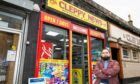 Iftekhar Yaqub outside the new Cleppy News shop in Dundee