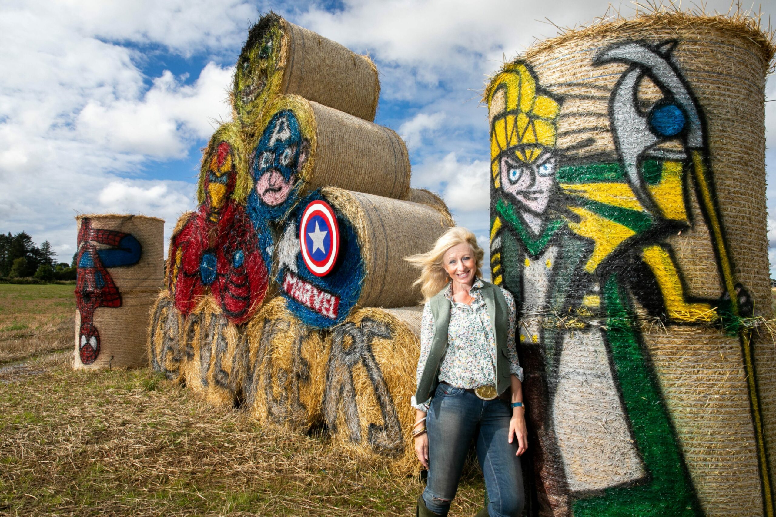 Artist Fleur 'Balesy' Baxter at her recent creation of characters from The Avengers to help raise funds for Cancer Research.