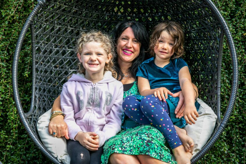 Amy with her daughters Sosi, who has cystic hygroma, and Alannah