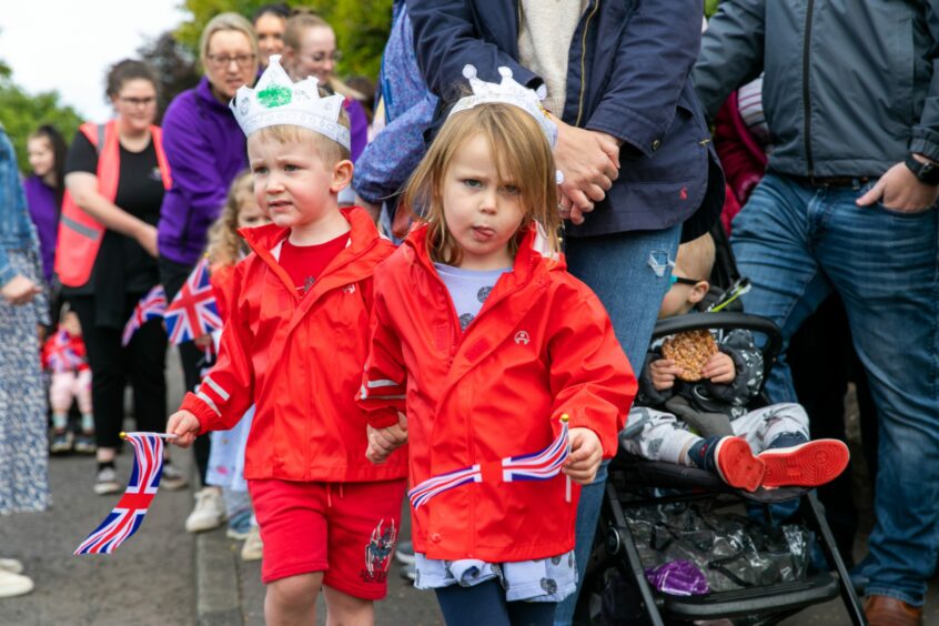 toddlers carrying Union Jack flags
