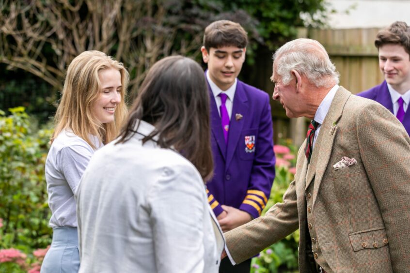 King Charles meets volunteers from the Broke not Broken foodbank garden