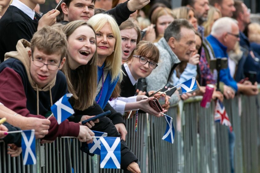 Close up of people in the crowd waiting for the King in Kinross