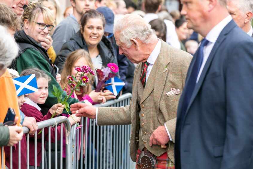 King Charles accepts flowers from little girl in Kinross