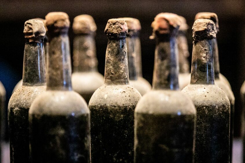 Dark, dusty whisky bottles from the cellar of Blair Castle