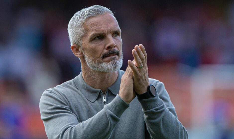 Jim Goodwin salutes the Dundee United fans.
