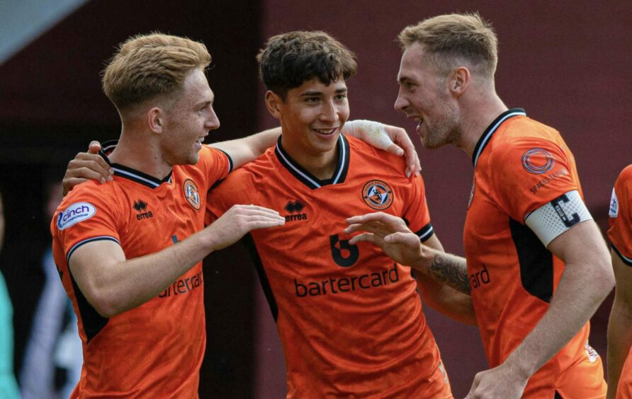 Scott Constable, centre, celebrates with Dundee United duo Kai Fotheringham, left, and Kevin Holt