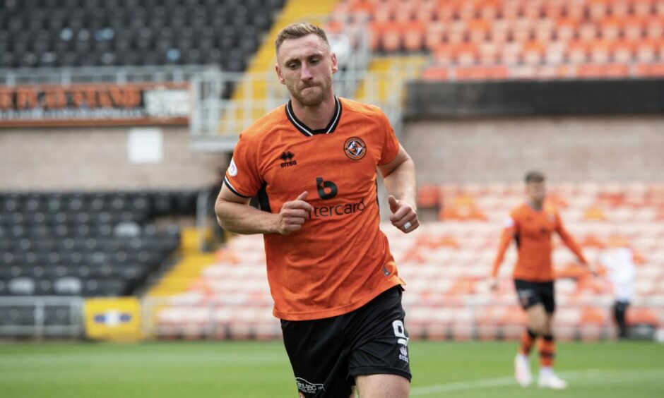 Louis Moult celebrates a goal for Dundee United against Morton