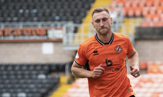Louis Moult celebrates a goal for Dundee United against Morton
