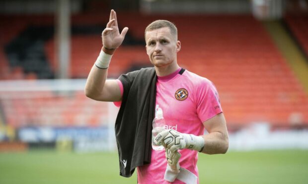 Dundee United No.1 Jack Walton leaves the pitch at Tannadice.