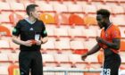 Referee David Munro, left, after showing a red card to Mathew Cudjoe of Dundee United