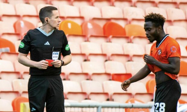 Referee David Munro, left, after showing a red card to Mathew Cudjoe of Dundee United
