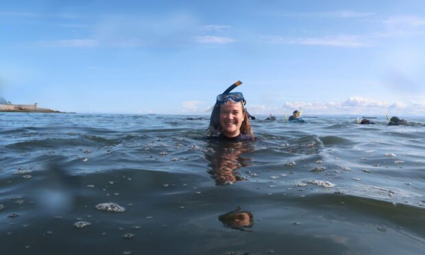 A snorkeller enjoying the water off Ravenscraig beach, Kirkcaldy, part of the South Fife Snorkel Trail.