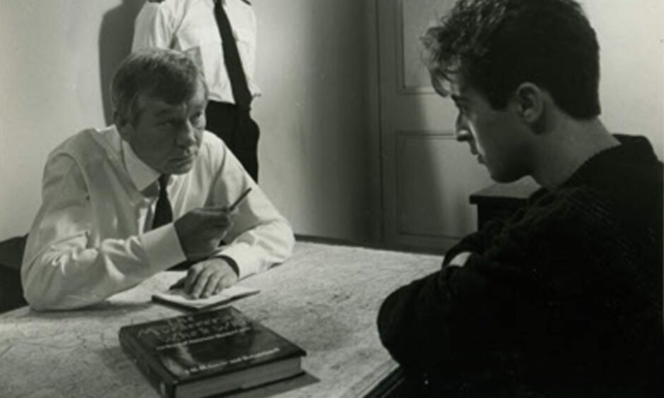 Alan Cumming's character is interviewed by Mark McManus's Taggart in Death Call. Image: Supplied.