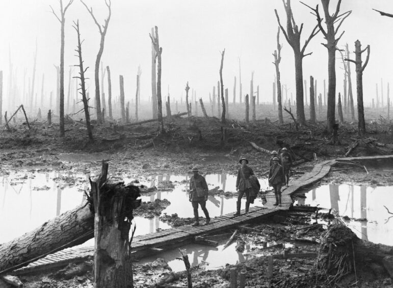 Troops amid the devastation at Ypres.