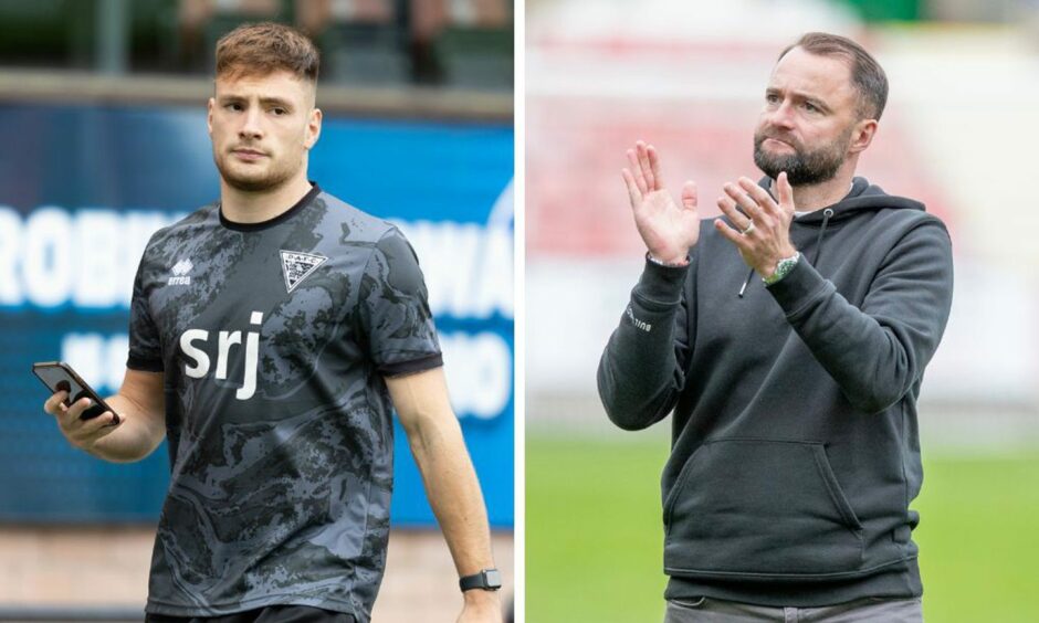 Dunfermline Athletic defender Josh Edwards walks down the touchline at East End Park holding his phone and Pars manager James McPake claps the supporters.