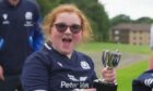 Caitlin Wilkie after receiving a trophy at a Scotland training session. Image: BBC/The One Show.