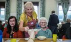 Liz Howson serves up pudding at the latest Brechin Soup Initiative lunch. Image: Mhairi Edwards/DC Thomson