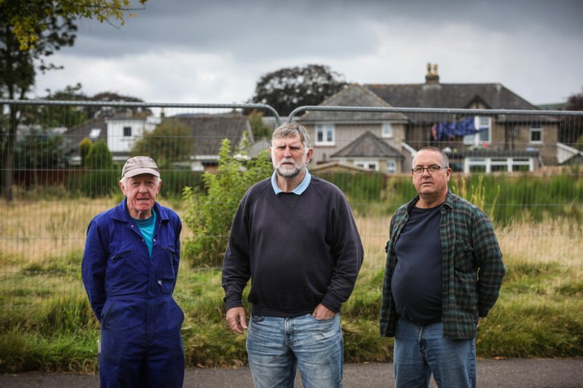 Residents Don Cameron (left) and Graham Wood with Inveresk community council chairman Gus Leighton (centre) at the site.