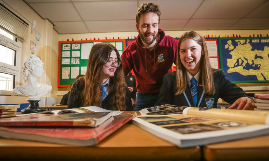 Monifieth pupils Sarah Ramsay, 16 and Eilidh Mutten, 17 with Classics Teacher George Connor.