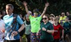 Bryony Walker bright in green for the start of the 250th Montrose parkrun. Image: Mhairi Edwards/DC Thomson