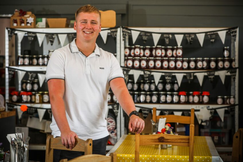 22-year-old Owen Foster standing inside Foster's Farm Shop and Cafe.