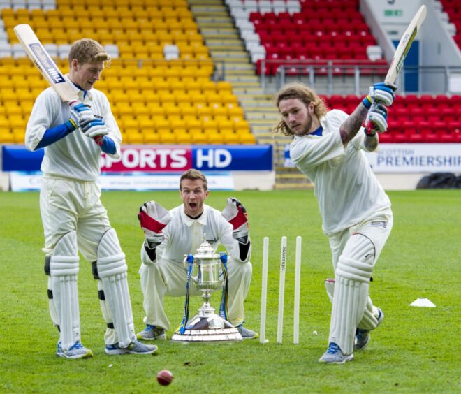Chris Millar getting kitted out in cricket whites for a Scottish Cup photocall.