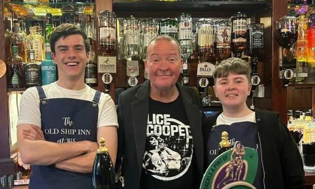 Still game star Paul Riley with Old Ship Inn bar staff in Perth