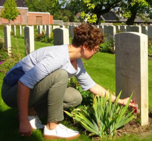 Marijke Vandevyvere at the grave in Flanders. 