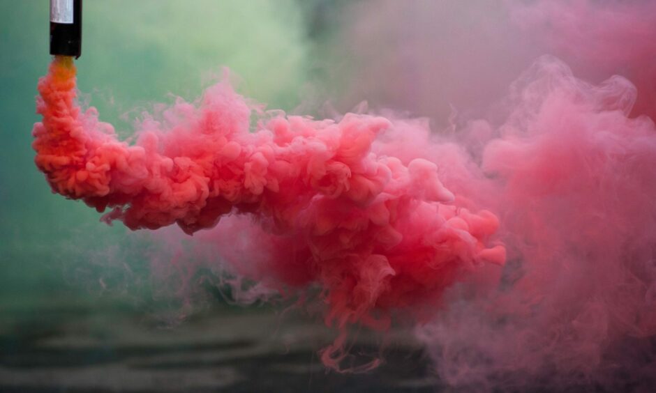 A red smoke bomb