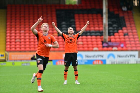 Louis Moult, background, celebrates Kai Fotheringham's goal for Dundee United