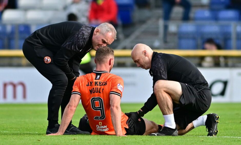 Dundee United striker Louis Moult receives treatment