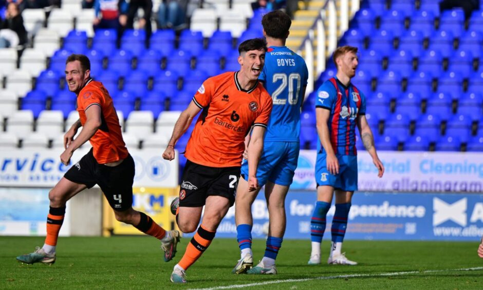 Dundee United's Chris Mochrie wheels away in celebration in Inverness