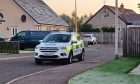 Police remained at Dunnichen Avenue in Forfar on Tuesday after the death of a 37-year-old man