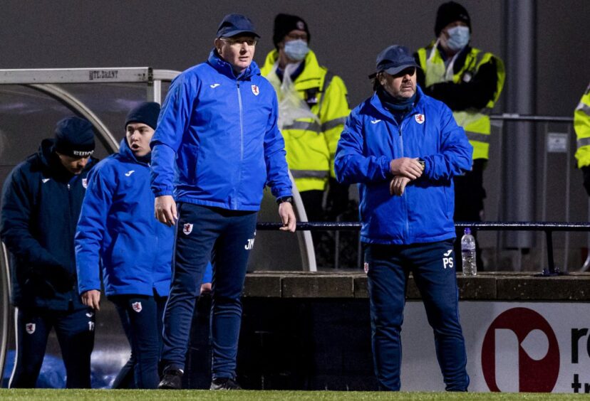 Paul Smith and John McGlynn, pictured on the sidelines, had two spells as a management duo at Raith. Image: SNS.