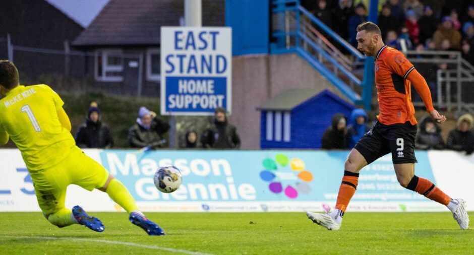 Louis Moult of Dundee United is denied in Peterhead