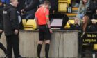 Willie Collum consults his VAR monitor before ruling out Amadou Bakayoko's 'offside' goal against Livingston. Image: SNS