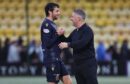 Dundee boss Tony Docherty jokes with Joe Shaughnessy after victory at Livingston. Image: SNS