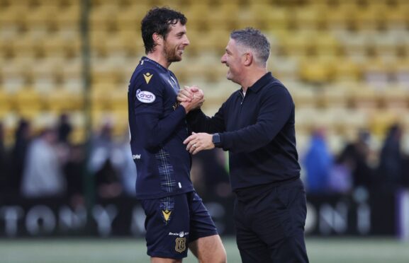 Dundee boss Tony Docherty jokes with Joe Shaughnessy after victory at Livingston. Image: SNS