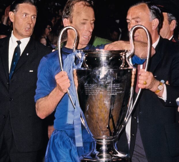 Manchester United's Bobby Charlton lifts the European Cup