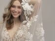 bride posing in lace wedding dress