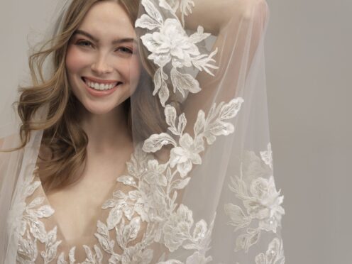 bride posing in lace wedding dress