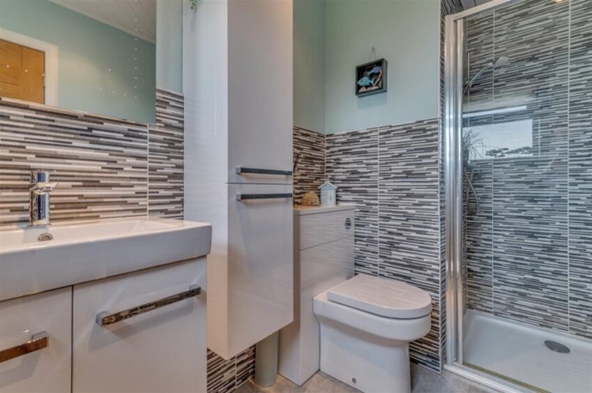 The master benefits from an en-suite shower room. 