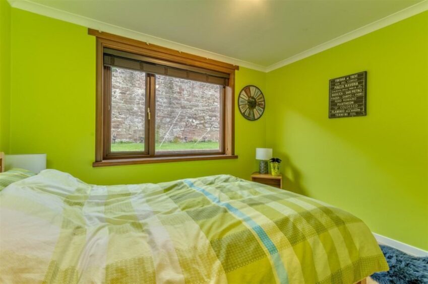 A bright green bedroom. 