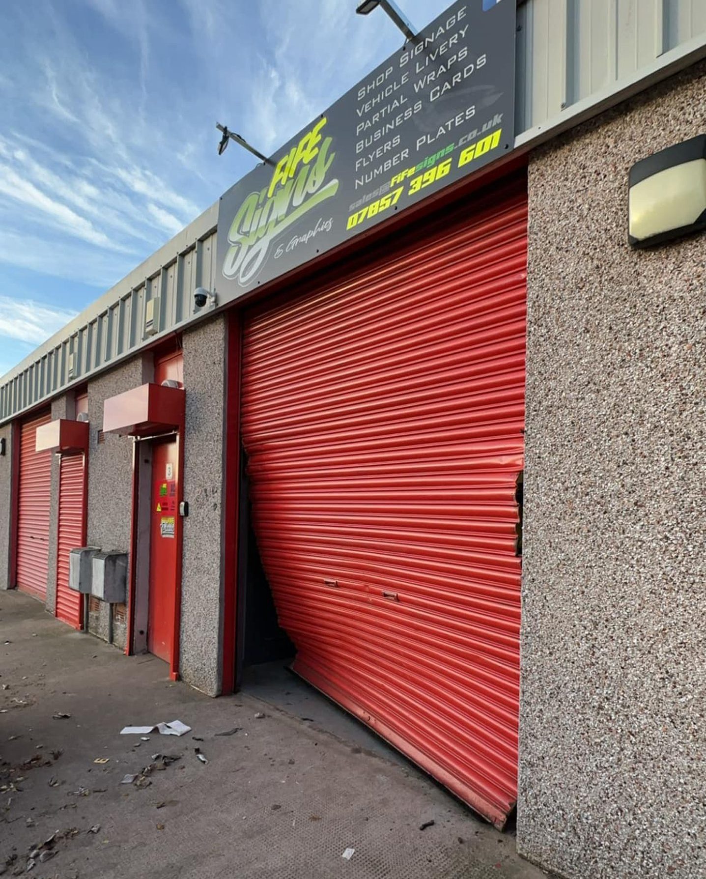 The damage to the shutters of Fife business in CCTV car raid 