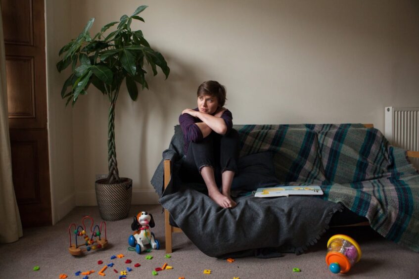 concerned woman on sofa