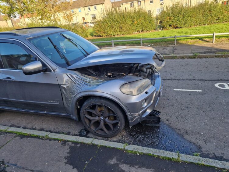 Damaged car after fire on St Fillans Road Dundee