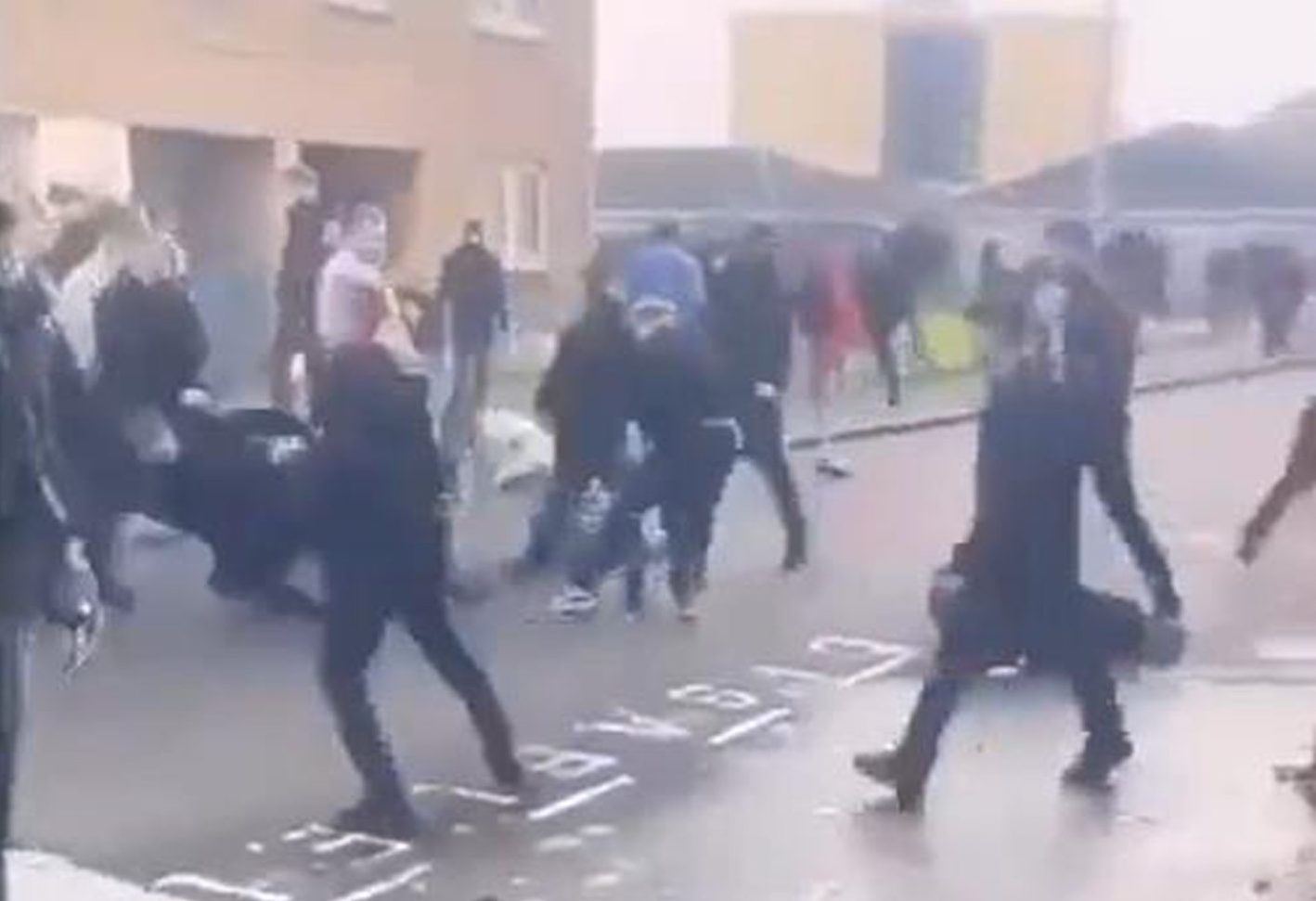 Rival Raith Rovers and Dunfermline Athletic fans fighting on Link Street in Kirkcaldy.